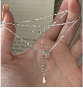 Close-up of S925 sterling silver minimalist cube pendant with adjustable drop-end chain