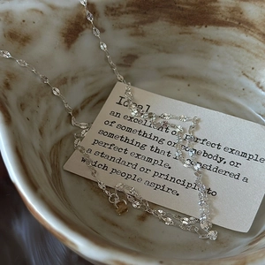 Elegant S925 sterling silver petal link necklace with yellow crystal in ceramic bowl