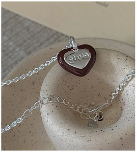 Detailed close-up of S925 silver heart pendant featuring the grow engraving and enamel trim