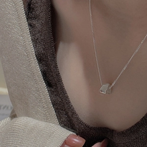 Minimalist S925 sterling silver geometric square pendant necklace worn by a fashion model