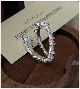 Close-up of S925 sterling silver ring with vintage spiral texture in a gift box