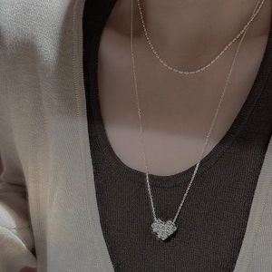 Double layered S925 silver heart pendant necklace with shimmering zircon stones