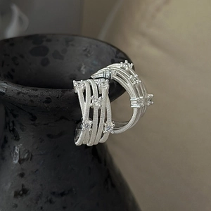 S925 sterling silver crossover earrings with sparkling zircons on black ceramic base