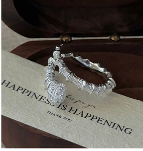 Detail of S925 silver wrap ring with twisted texture and rectangular zircon stone