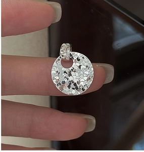 Detailed view of S925 sterling silver round pendant with hammered texture finish