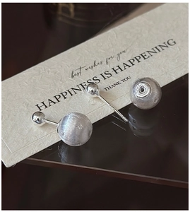Macro view of S925 sterling silver star stud earrings with brushed and polished texture