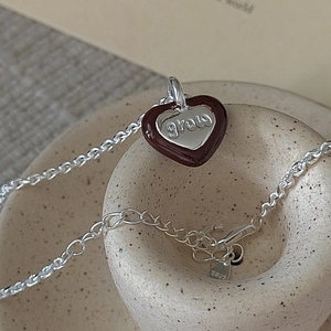 Minimalist S925 sterling silver heart necklace featuring a brown enamel grow pendant