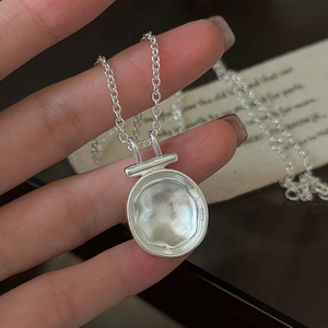 Minimalist S925 sterling silver necklace with a unique lava texture round pendant