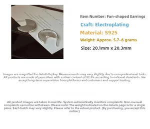 Detailed view of silver fan-shaped S925 sterling silver earrings with textured finish
