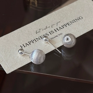 Minimalist S925 sterling silver brushed star earrings featuring a double bead design