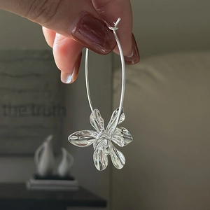 Handcrafted S925 sterling silver hoop earrings with a large three-dimensional flower charm