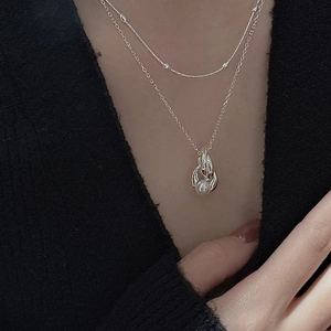 Double-layered S925 silver necklace with white pearl pendant on elegant model