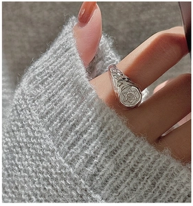 Detail of S925 sterling silver hex star ring with a textured hammered finish for women