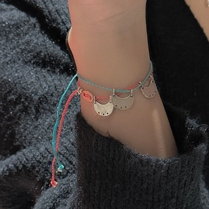 Bohemian style woven bracelet set with coral and turquoise ropes and silver moon charms