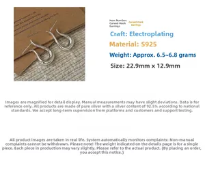 Macro shot of S925 sterling silver hook earrings with 22.9mm x 12.9mm size details
