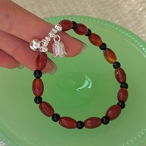 Vintage S925 sterling silver red agate beaded bracelet with bell and tulip charms