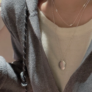 Minimalist S925 sterling silver layered necklace set with geometric pendants on model