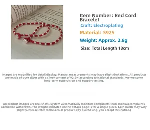 Detailed specs of S925 sterling silver beads on a handcrafted red woven rope bracelet