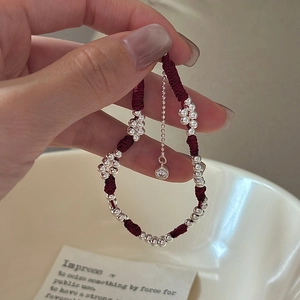 Minimalist S925 sterling silver beads red woven rope bracelet worn on a female wrist