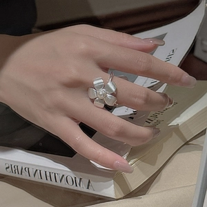 S925 sterling silver floral ring with white pearl on model hand in retro vintage style