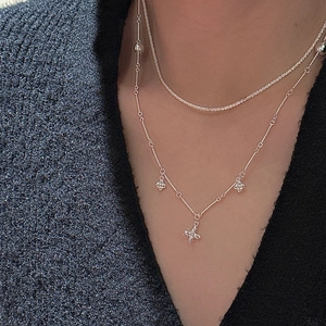 Layered S925 sterling silver necklaces with shimmering bead chain and floral pendants