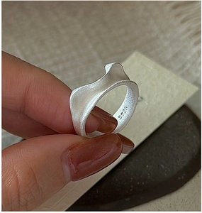 Close-up of S925 sterling silver cat ear ring with matte finish and hallmark engraving