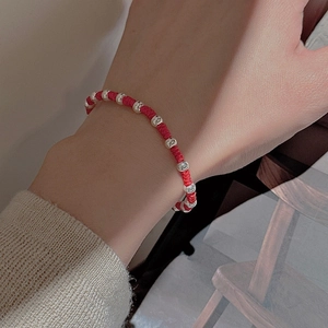 Minimalist S925 sterling silver beads on a handcrafted woven red rope bracelet