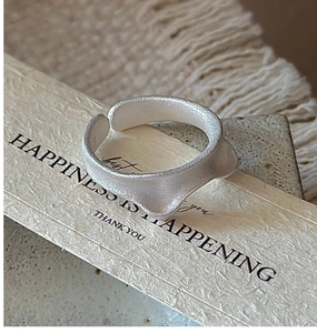 Detailed macro view of matte S925 sterling silver cat ear ring with S925 hallmark