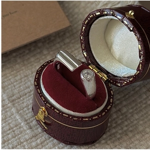 Macro detail of S925 sterling silver ring with zircon stone in a red leather gift box