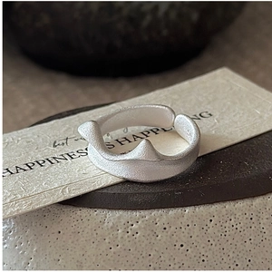 Detail of S925 sterling silver adjustable cat ear ring with matte frosted texture