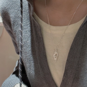 S925 sterling silver minimalist necklace with abstract pendant on a model