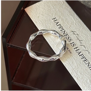 Close-up of S925 sterling silver ring with molten lava texture and high-polish finish