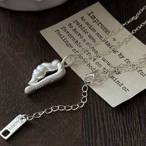 S925 sterling silver necklace with minimalist irregular pendant on vintage background