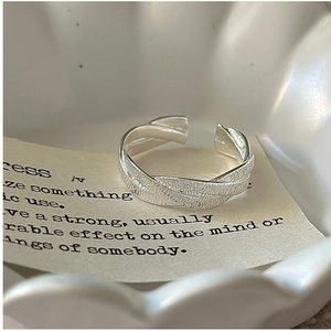Detail of adjustable S925 sterling silver ring with handcrafted hammered texture