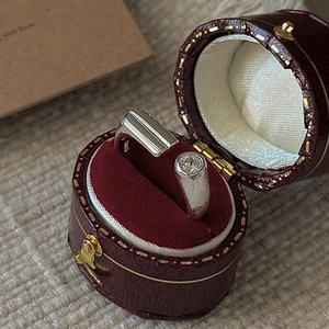 Minimalist S925 sterling silver open ring with cubic zirconia in a vintage red jewelry box