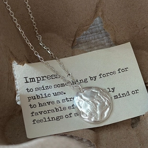 S925 sterling silver necklace with textured irregular coin pendant and tiny zircons