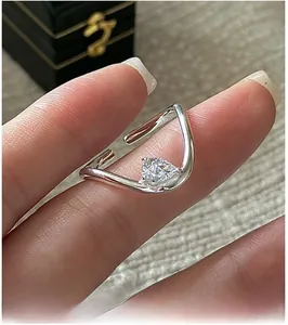 Detailed close-up of a pear-cut cubic zirconia teardrop ring in minimalist S925 silver