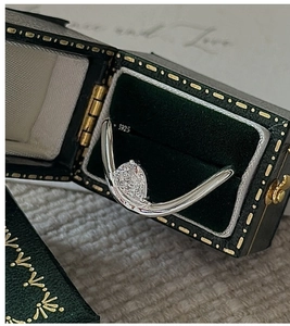 Detailed macro shot of S925 sterling silver ring with pear-shaped gemstone in V-shape