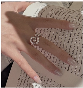 Macro shot of minimalist S925 sterling silver ring with vintage spiral texture