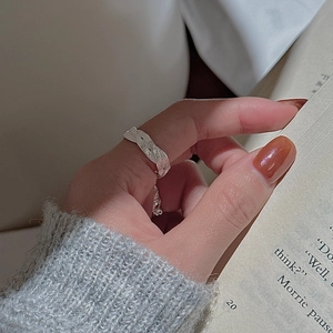 Adjustable S925 sterling silver ring with handmade hammered wavy texture on female index finger