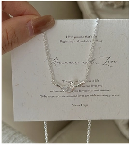 Detail of S925 sterling silver knot necklace featuring a pear-cut zircon stone