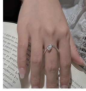 Detail of S925 sterling silver ring with V-shaped band and pear-cut gemstone