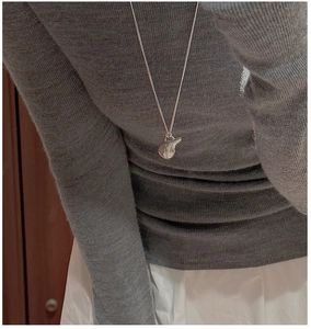 Minimalist S925 sterling silver necklace with irregular lava-style fluid pendant worn on neck