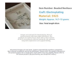 Detailed view of S925 silver beaded necklace with star charms and electroplated finish