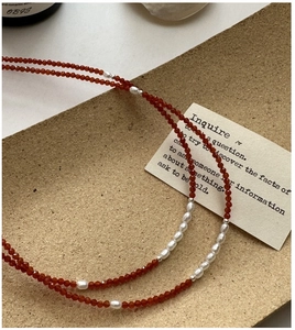 Detail of S925 silver necklace with red spinel beads and white baroque pearls