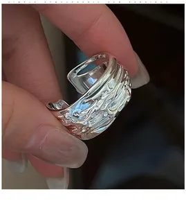 Close-up of S925 sterling silver ring featuring unique molten lava texture and wavy pattern