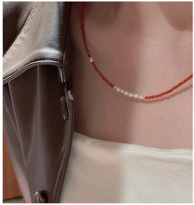Detail of S925 silver necklace featuring red spinel beads and white baroque pearls