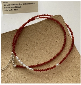 Close-up of S925 sterling silver necklace with red spinel beads and white rice pearls