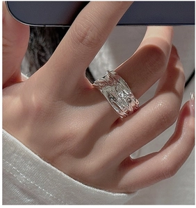 Close-up of S925 sterling silver ring with irregular lava liquid metal texture finish