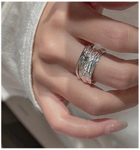 Detail of S925 sterling silver ring featuring unique liquid metal texture and lava style design